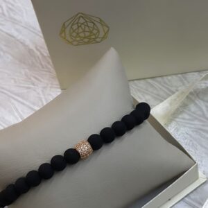 Pulsera de oro, balín y neopreno